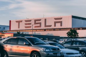 cars parked in front of company building